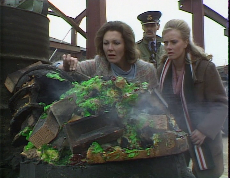 Rachel, Allison, and Ian inspecting the green goo inside an exploded Dalek